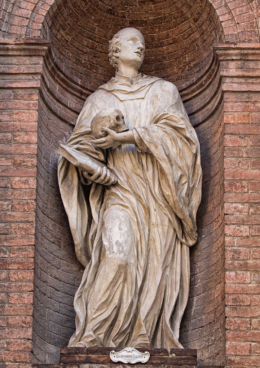 A statue of San Bernardo Tolomei on the Chiesa di San Cristoforo in the Piazza Tolomei, Siena Italy.
