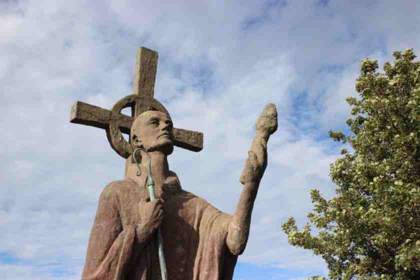 st aidan carrying the flame