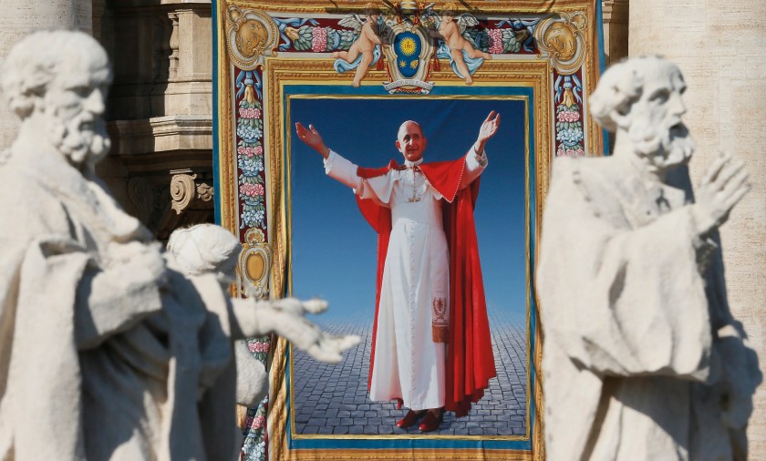 Tapestry of Blessed Paul VI hangs from facade of St. Peter's Basilica during his beatification Mass at Vatican