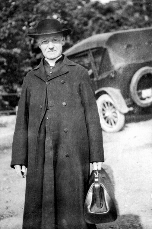 st andre bessette in coat
