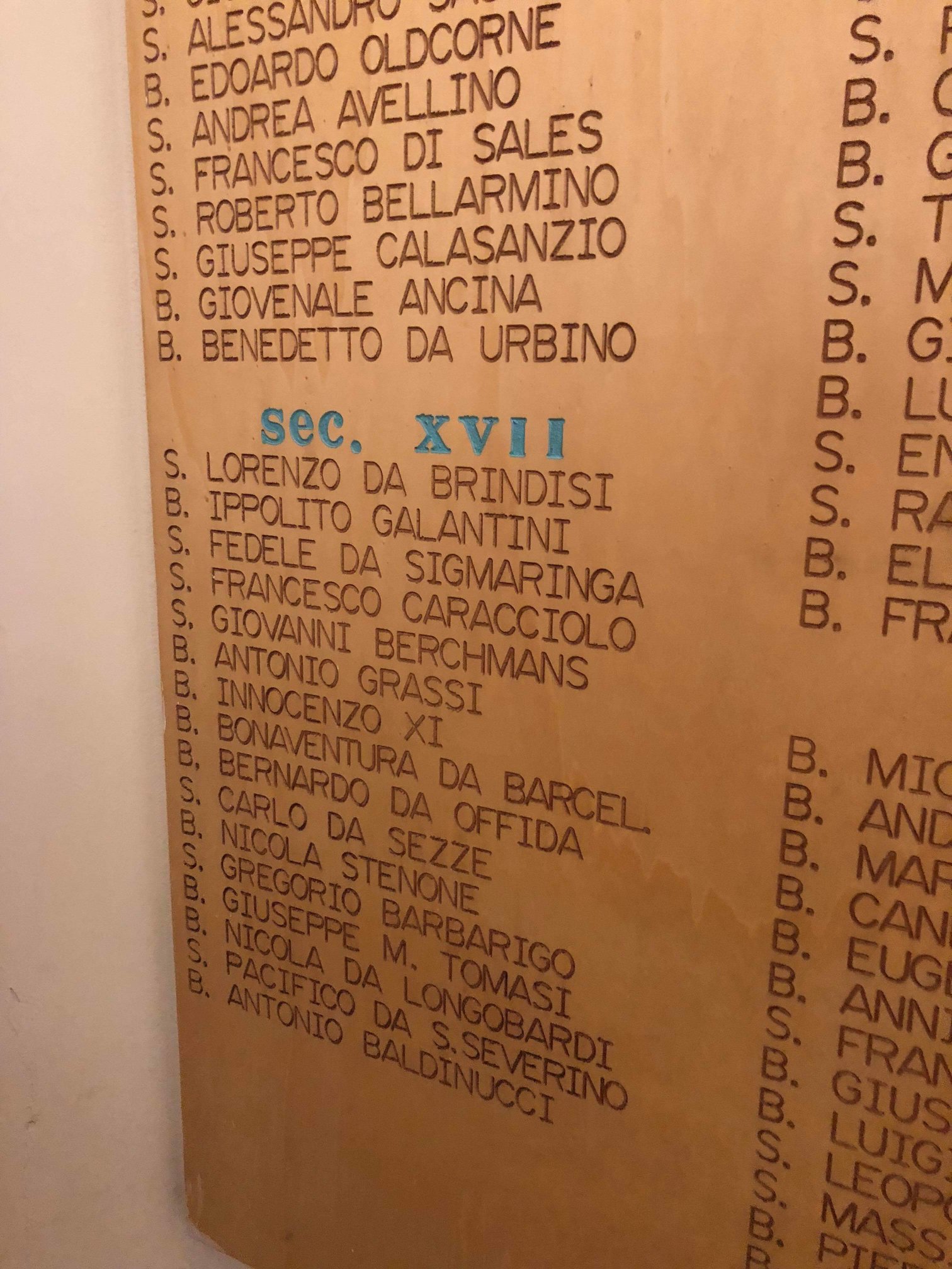 Sanctuary of Our Lady of Loreto in Loreto, Italy detail of the plaque showing the saints who visited the shrine