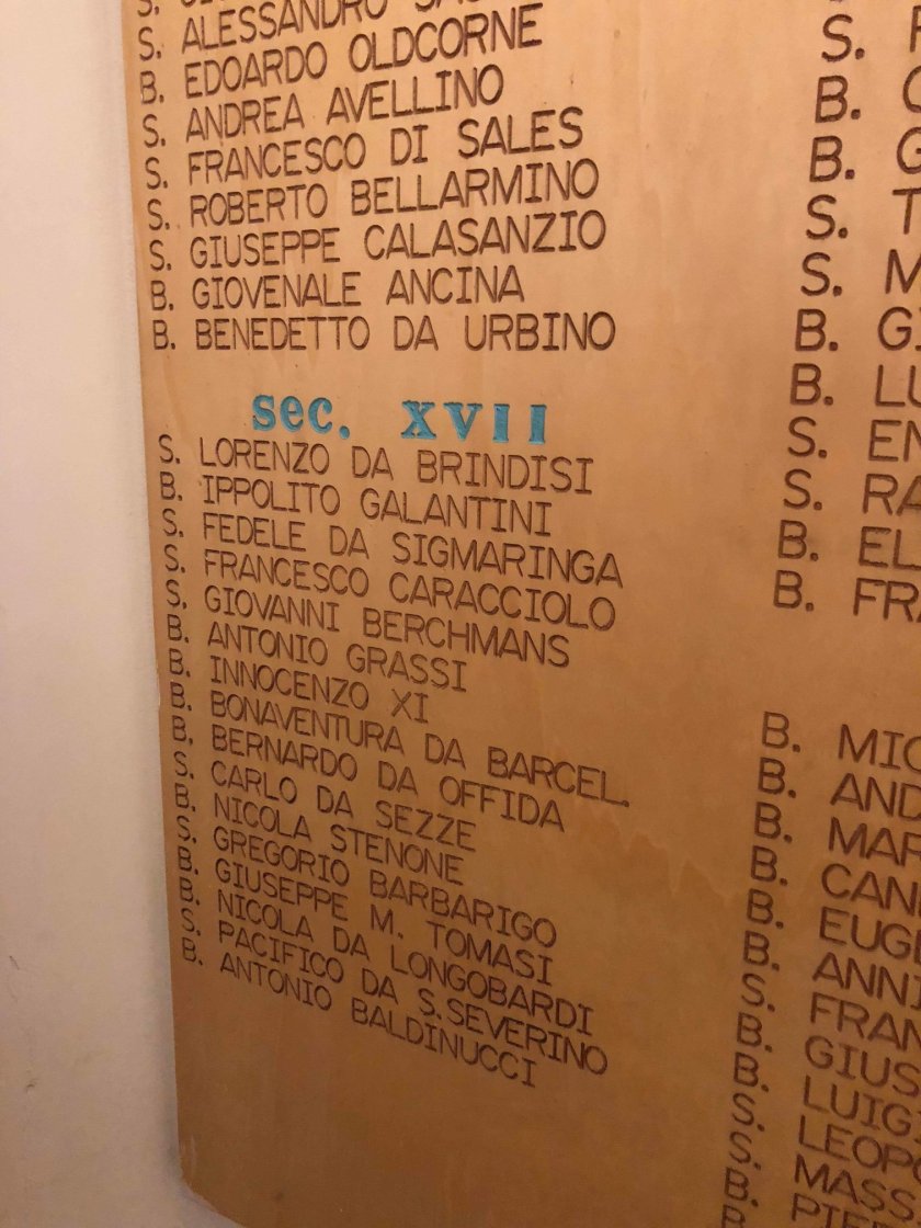 Sanctuary of Our Lady of Loreto in Loreto, Italy detail of the plaque showing the saints who visited the shrine